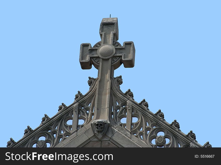 Cross on top of an old church with a bright blue sky background. Cross on top of an old church with a bright blue sky background