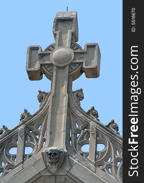 Cross on top of an old church with a bright blue sky background. Cross on top of an old church with a bright blue sky background