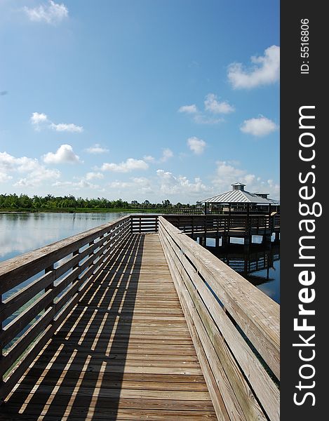 Wooden walkway leading out over water