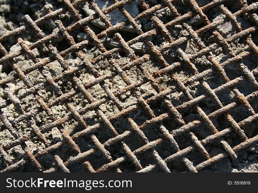 A rusty grid on the morning sunlight