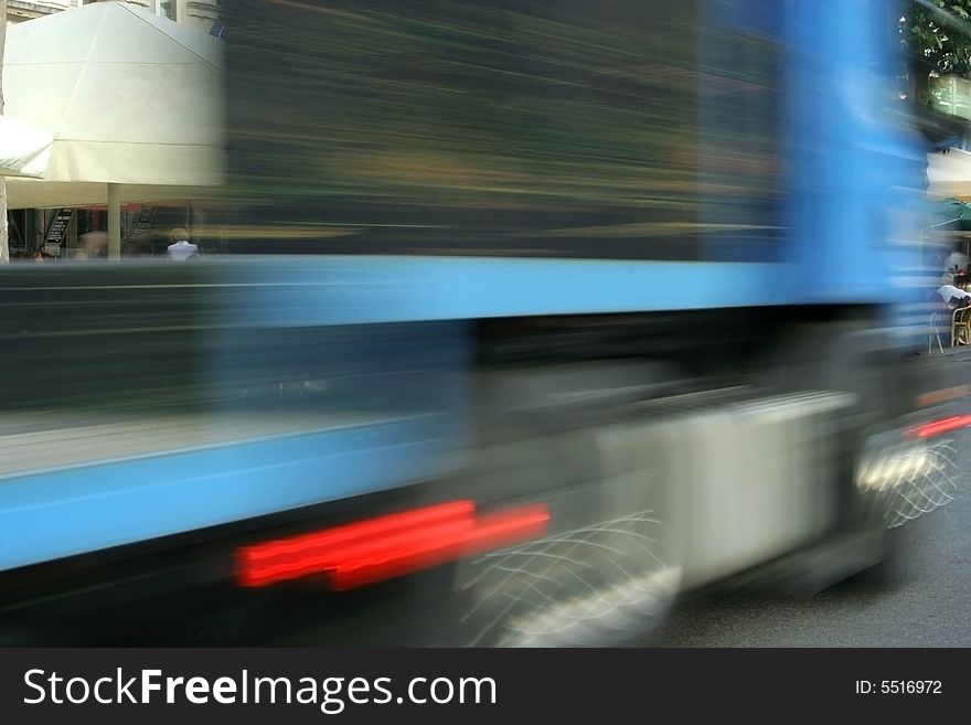 Photo taken at street while a truck passing. Photo taken at street while a truck passing