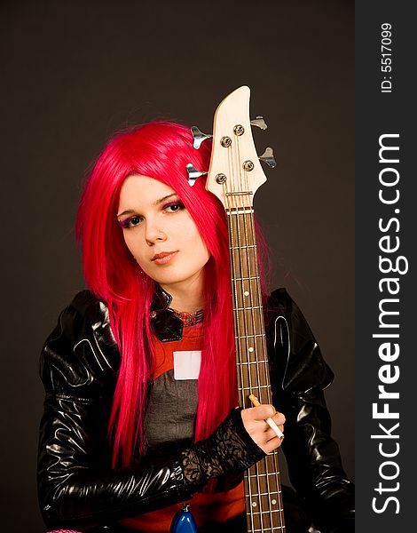 Romantic girl with guitar isolated on black background