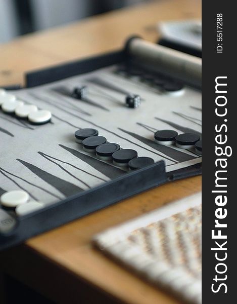 Backgammon board, pieces and dice with lots of focal blur. Backgammon board, pieces and dice with lots of focal blur