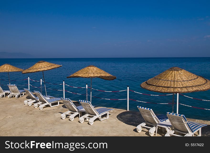 Sunshades in Turkish resort in the Aegean sea