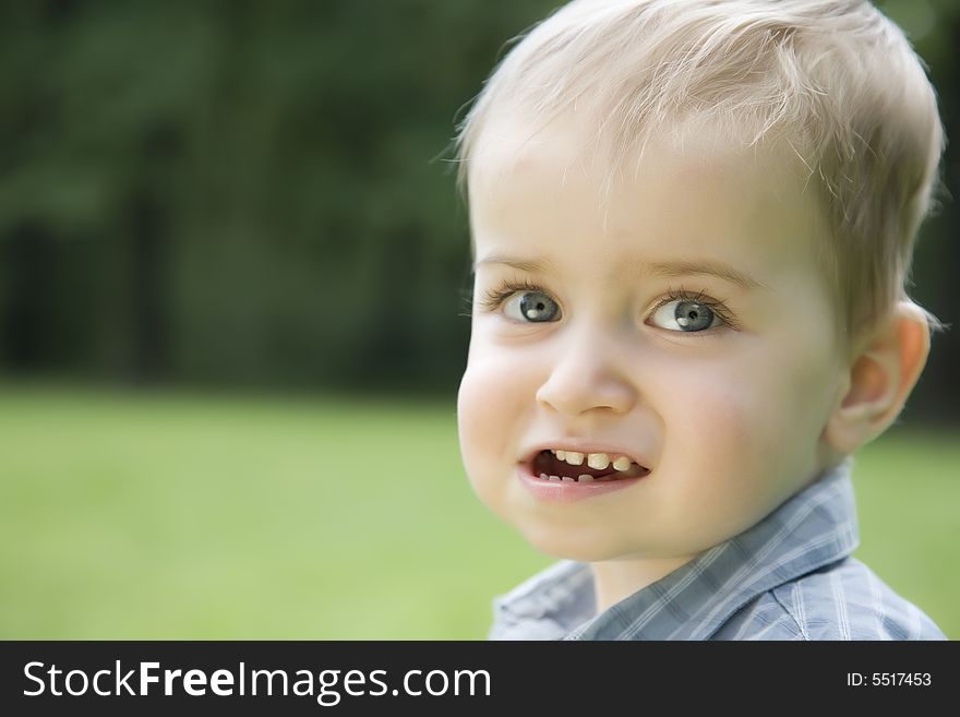 Smiling Baby Boy In The Park