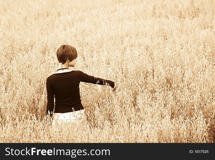 Woman on field, soft gilt toned.