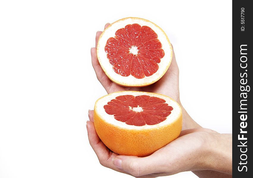 Closeup Of Hands With Grapefruit On White