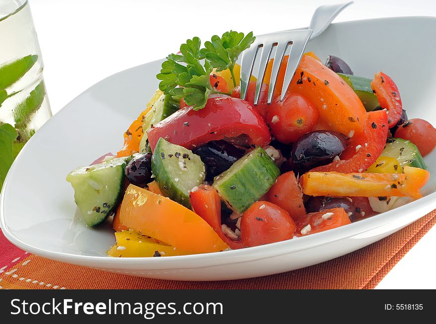Colorful and tasty vegetable salad in a white bowl. Colorful and tasty vegetable salad in a white bowl.