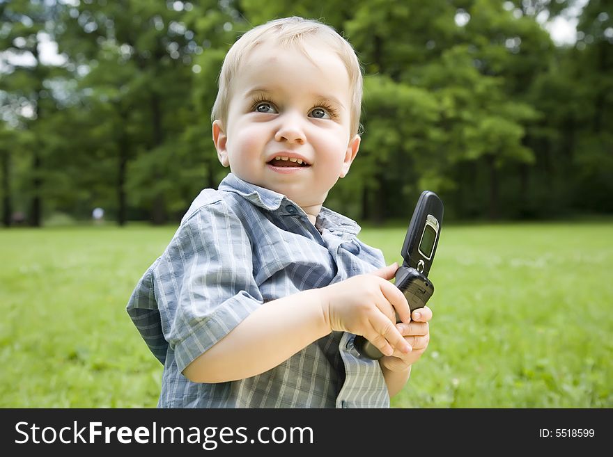 The Surprised Kid With Phone In His Hands