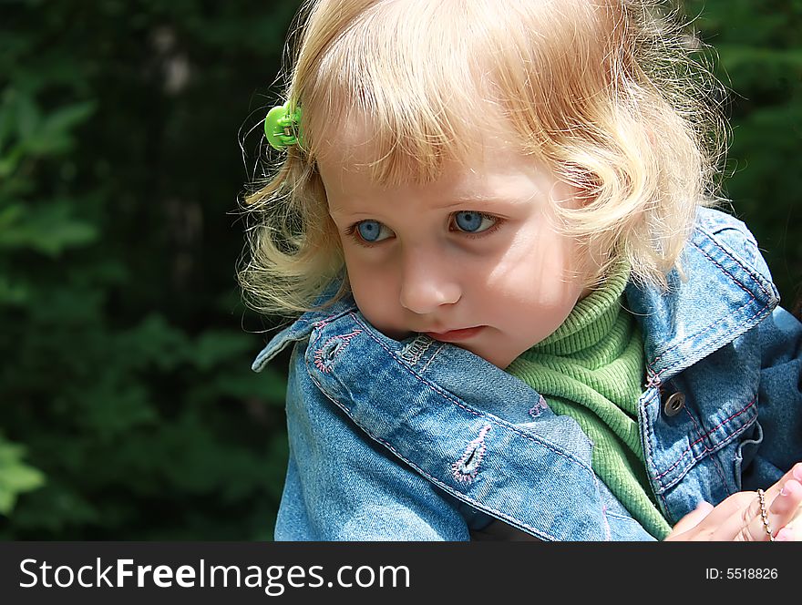 Portret of a blonde little girl with blue eyes. Portret of a blonde little girl with blue eyes