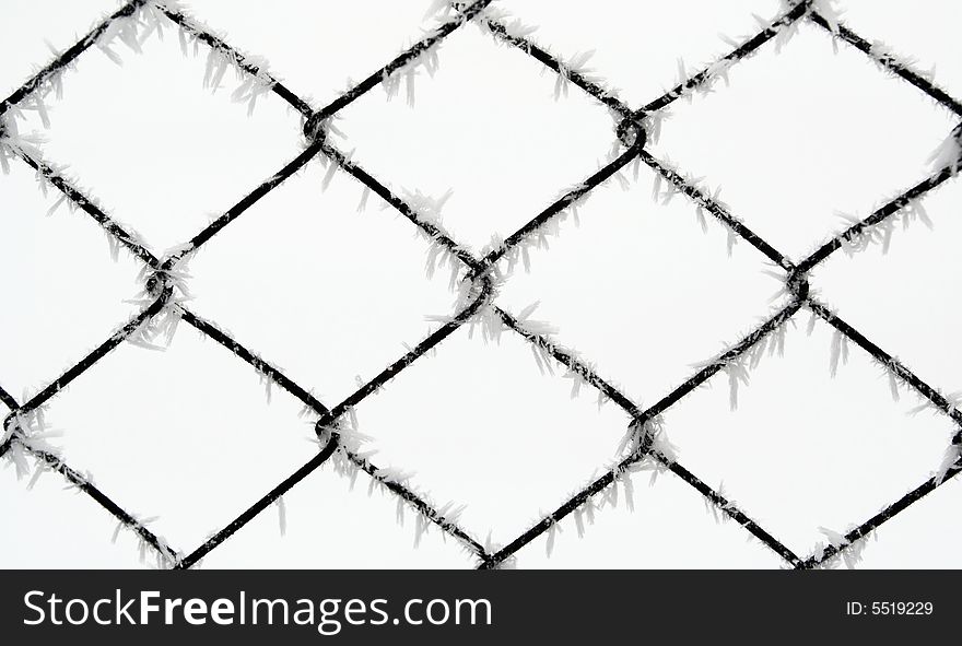 Wire fence during cold winter with frost. Wire fence during cold winter with frost