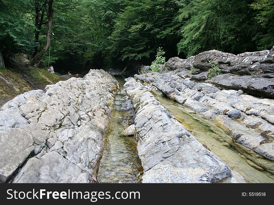 Mountain river in encirclement granite declivity