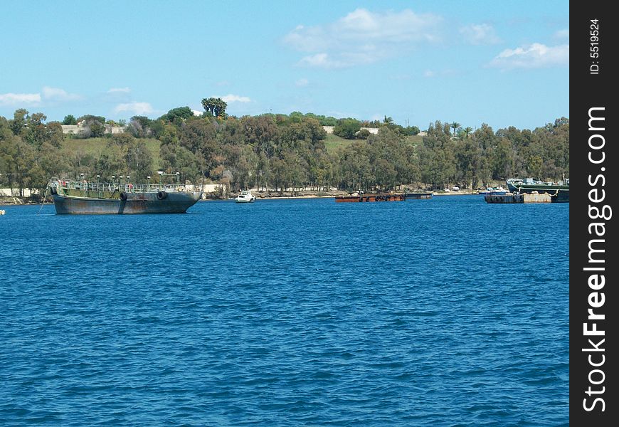 This is a photo of some wrecks in the port of August (Sicily)