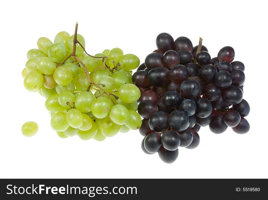 Green and blue grapes on a white background. Green and blue grapes on a white background.