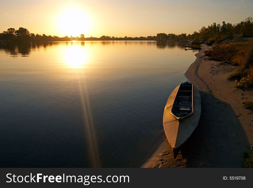 Sunset at riverside with boat