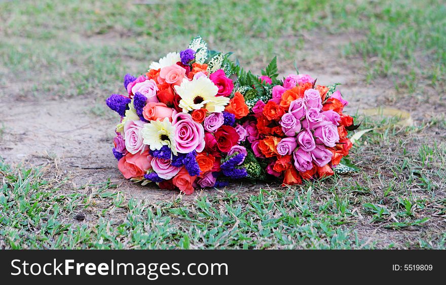 Colorful wedding bouquet on the grass.