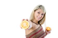 Young Happiness Woman Giving Sliced Orange. Royalty Free Stock Image Young Happiness Woman Giving Sliced Orange. Royalty Free Stock Image