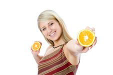 Young Happiness Woman Giving Sliced Orange. Stock Images Young Happiness Woman Giving Sliced Orange. Stock Images