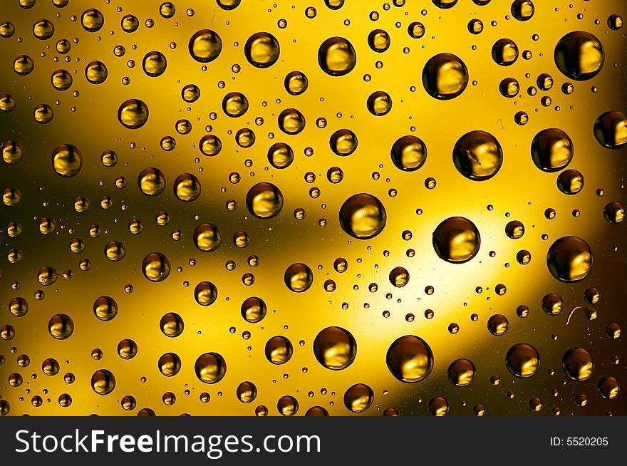 Yellow water drops spots background