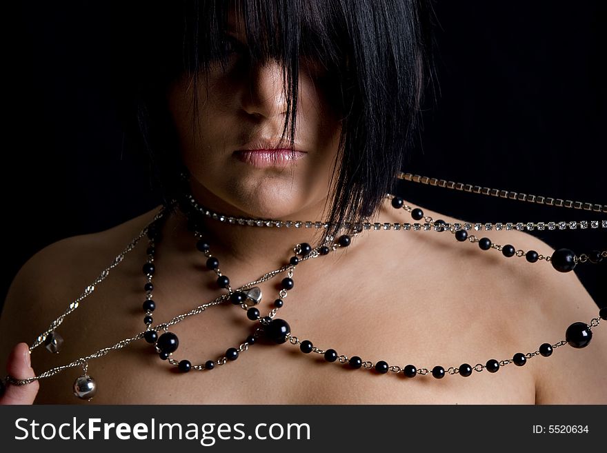 One young beutiful brunette with long necklace