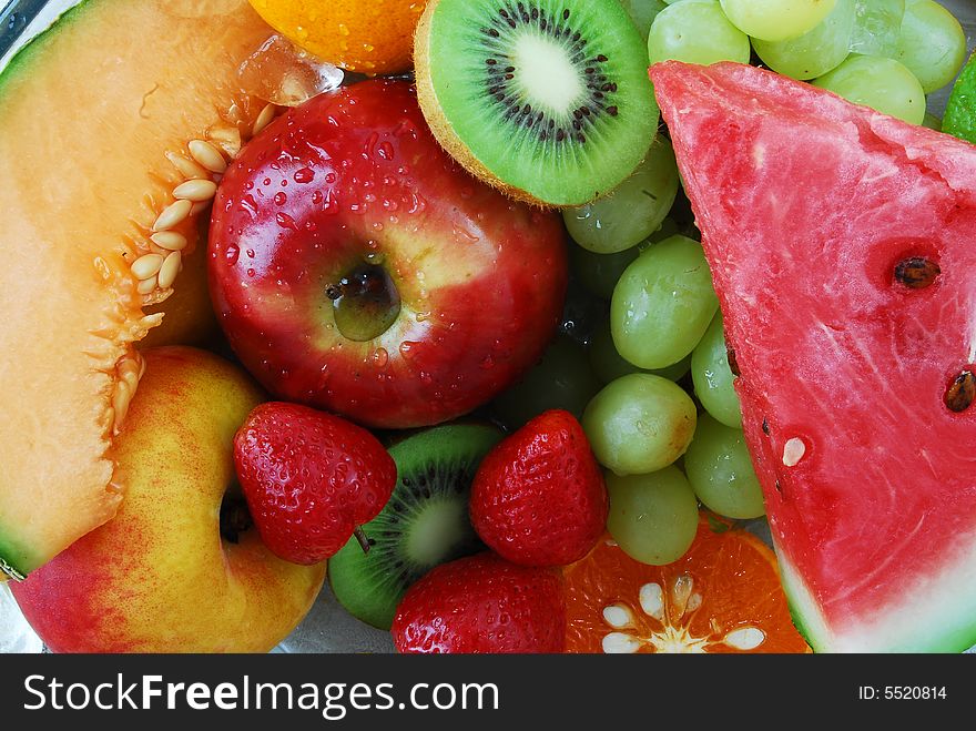 Colorful fresh group of fruits for a balanced diet. Black background. Look at my gallery for more fresh fruits and vegetables.