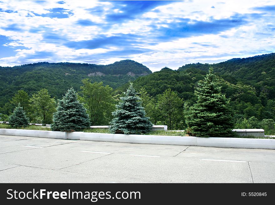 Mountain tops on background blue year sun