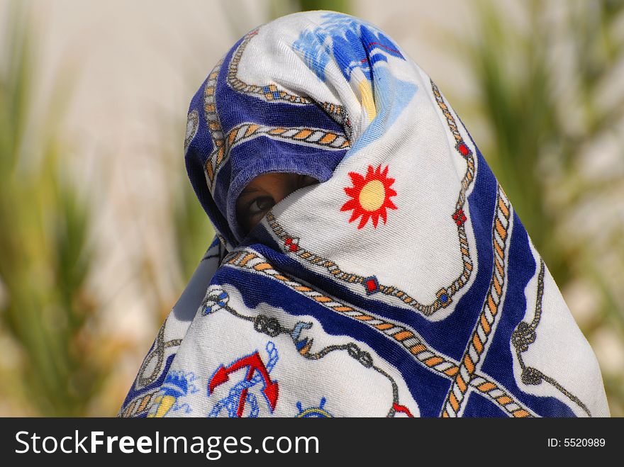 Boy wraps around a beach towel