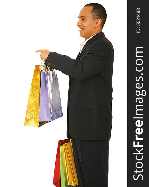 Isolated shot of male shopper holding shopping bags and pointing to different area. Isolated shot of male shopper holding shopping bags and pointing to different area