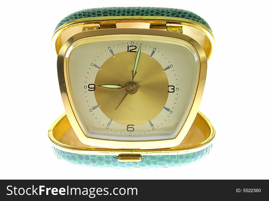 Old golden clock on white background