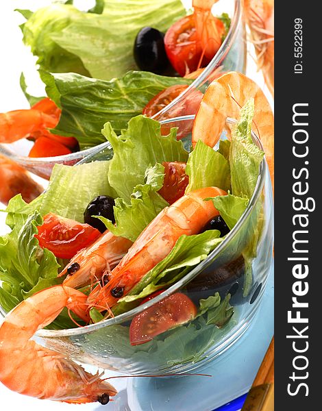 Fresh and tasty shrimp salad with iol and tomatoes