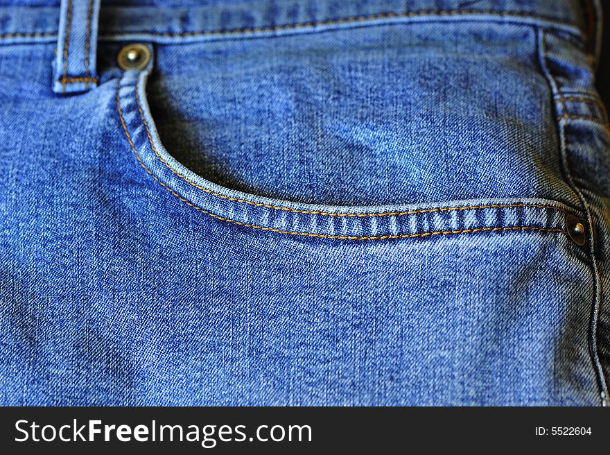 Front pocket on blue jeans. Front pocket on blue jeans