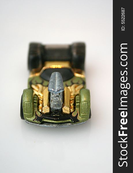 This close up of a toy race car shows the details from the front view.