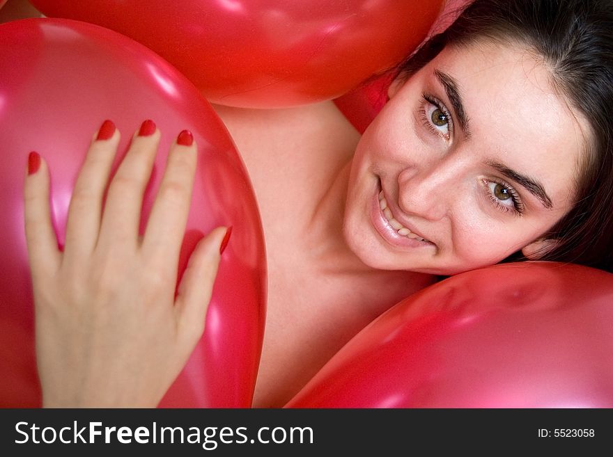 Beautiful girl in red balloons