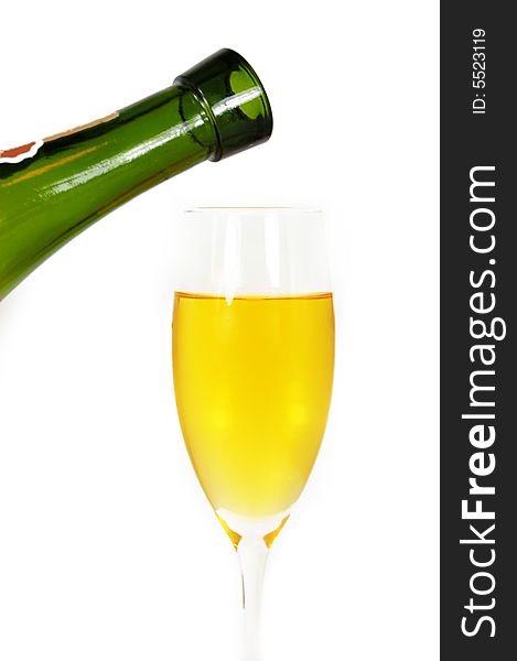 Pouring some white wine in glass, isolated on white. Pouring some white wine in glass, isolated on white
