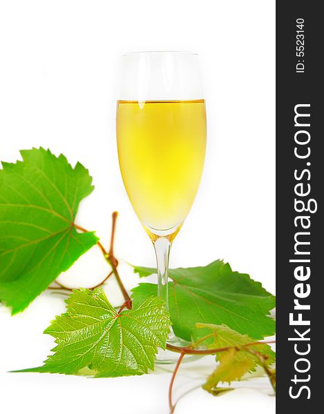 Muscat glass of wine with leaves on white