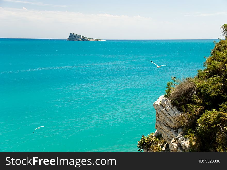 A sea landscape with cliffs.