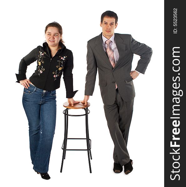 Girl with young man stands at stool. Girl with young man stands at stool