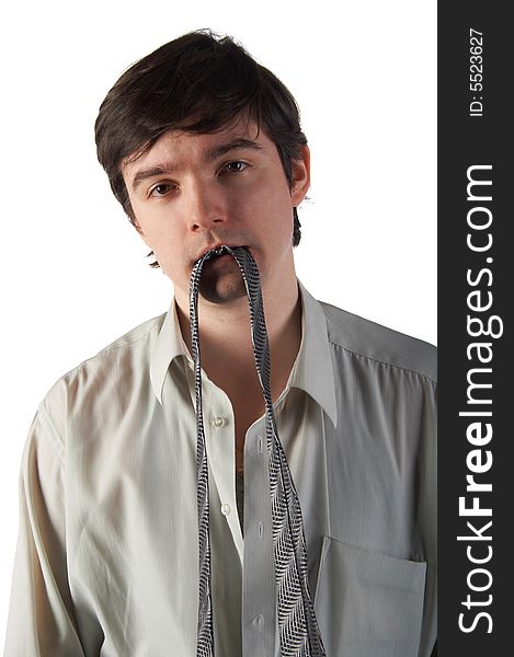 Young man hold necktie in teeth