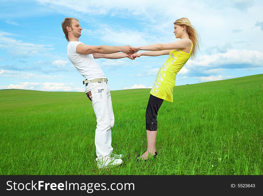 Young couple playing around in the nature