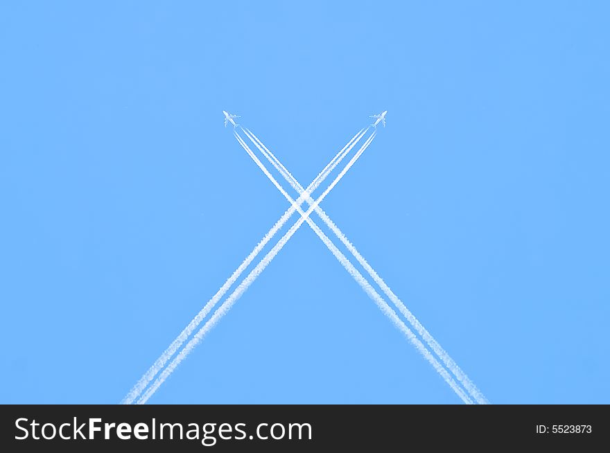 Airplanes crossing the blue sky