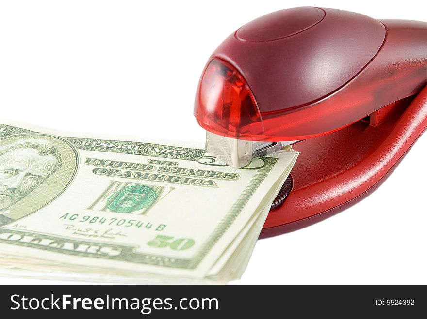 Stapler of red color and dollars