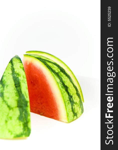 Sliced sweet summer watermelon against white background. Sliced sweet summer watermelon against white background