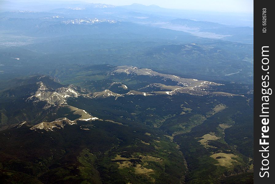 Above the Mountain tops of Colorado in June. It's amazing that there is snow there.