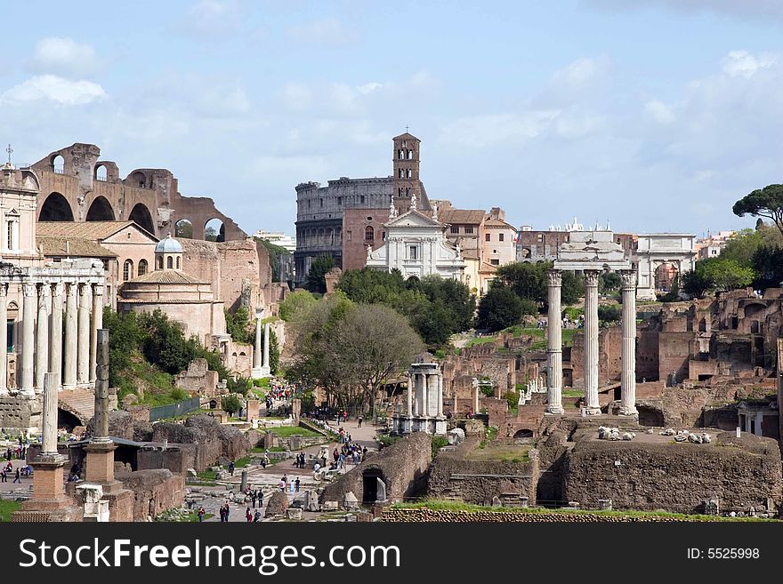 Forum in Rome, Italy, with the Coliseum in the background. Forum in Rome, Italy, with the Coliseum in the background