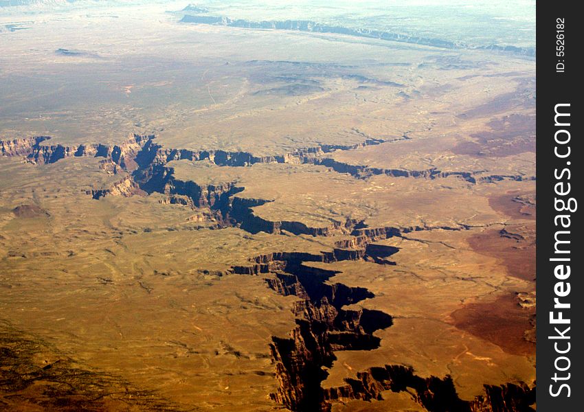 The canyon looks small from here but I'm sure that anyone who has been there would say different. From 32,000 feet it looks like a big crack in the mud. This is a nice example of this soft ground that it is eroding. The canyon looks small from here but I'm sure that anyone who has been there would say different. From 32,000 feet it looks like a big crack in the mud. This is a nice example of this soft ground that it is eroding.