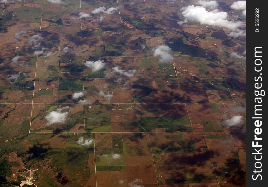 Crop fields with puffs of clouds and shadows. Crop fields with puffs of clouds and shadows.