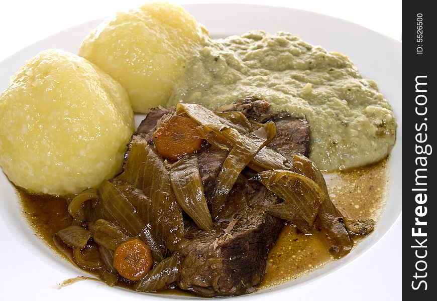 Roast beef with potato dumplings and cabbage