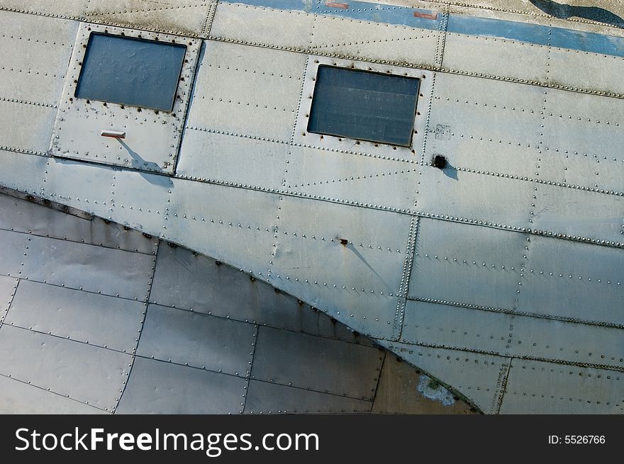 Details of fuselage of a series of IInd world war aircraft stored at airfield. Details of fuselage of a series of IInd world war aircraft stored at airfield