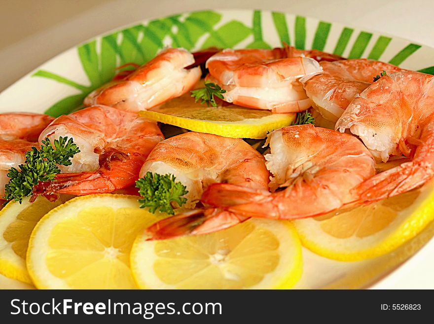 Large juicy boiled shrimps with lemon close up. Large juicy boiled shrimps with lemon close up