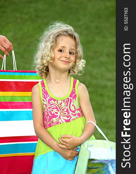 Girl with present in shopping bag. Girl with present in shopping bag